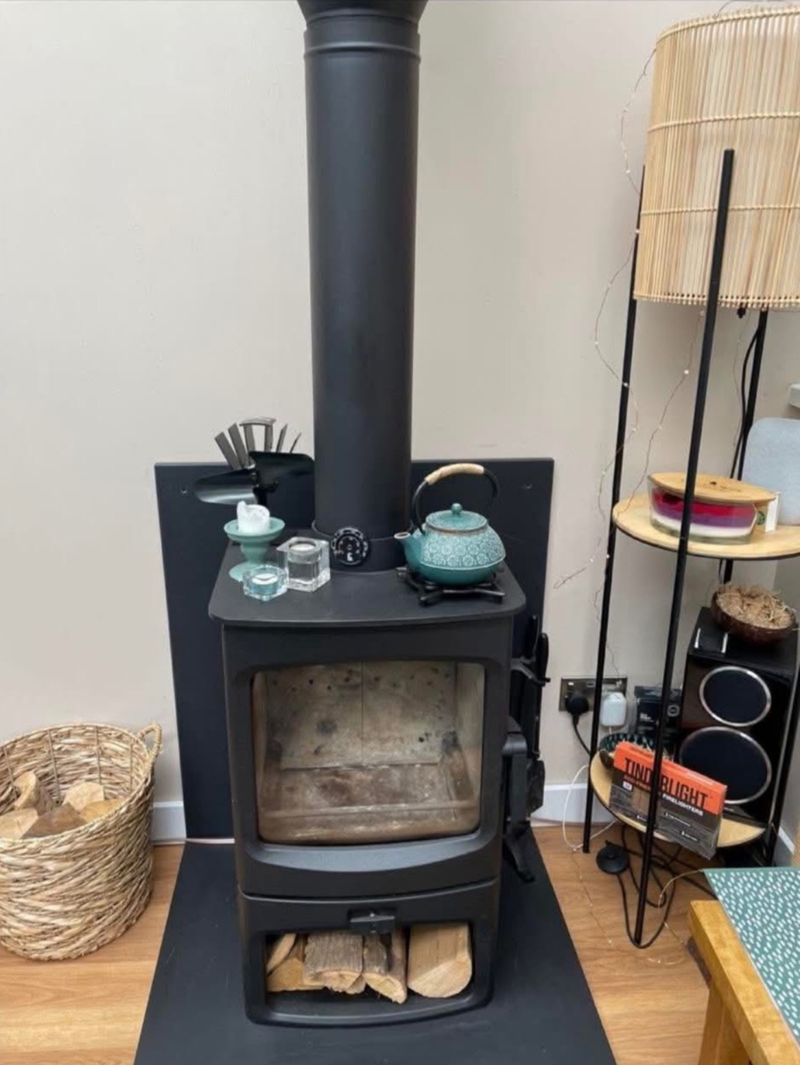 A+ chimney sweep equipment laid out beside a stove ready for work