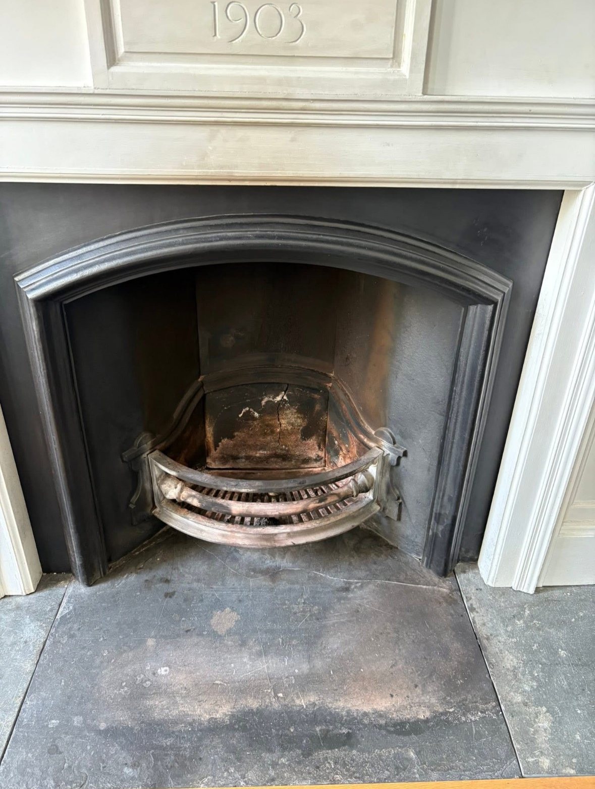 Fireplace hearth with ash removed during cleaning
