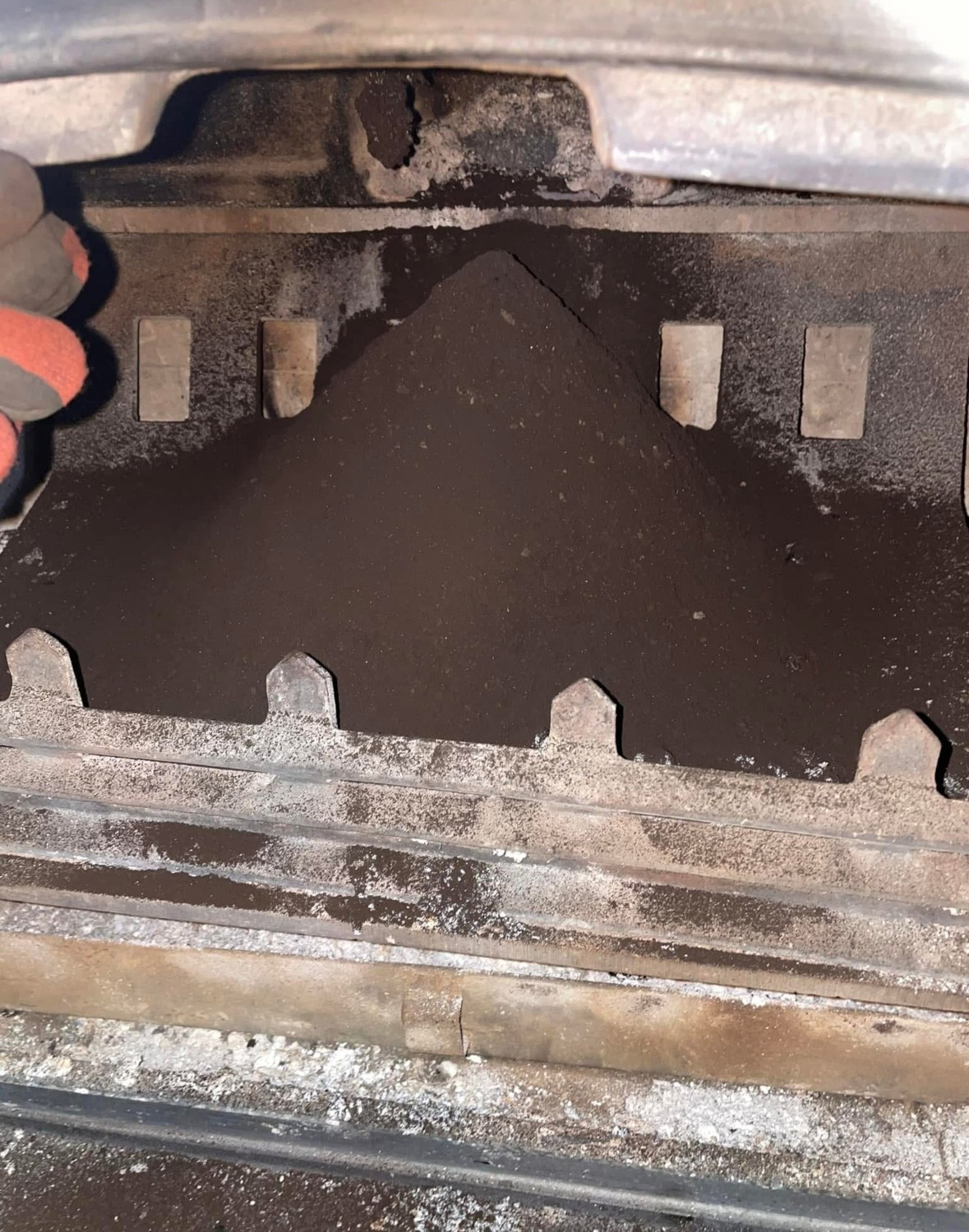 Close up of sooty chimney and flue interior during inspection